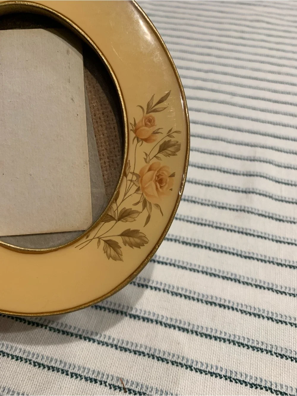 Vintage enamel oval photo frame featuring delicate yellow rose floral